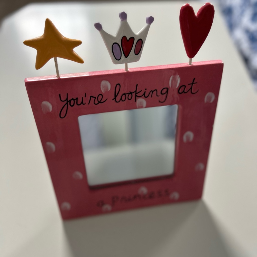 Mirror with picture type stand